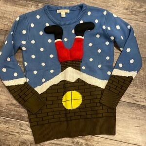 GET READY FOR UGLY CHRISTMAS SWEATER SEASON WITH THIS LIVE BY DESIGN SANTA